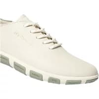 Cream TBS Jazaru women's canvas trainers with lace-up front and textured gray sole.