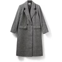 Gray double-breasted women's coat by Sofie Schnoor with notched lapels and front flap pockets.
