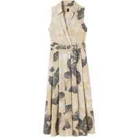 Sleeveless beige cross-over shirt dress by Stefanel with large dark leaf print and belted waist.