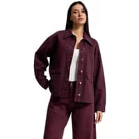 Purple women's denim jacket with rhinestone buttons, two front pockets, and a relaxed fit.
