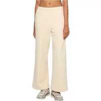 Cream-colored wide-leg joggers with fluffy texture, elastic waistband, and relaxed fit, worn with sneakers.