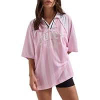 Pink and white striped Juicy Couture women's polo shirt with logo on front and short sleeves.