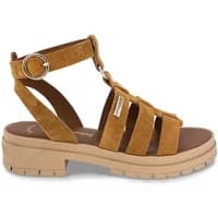Brown suede women's sandals with thick sole, ankle strap, buckle, and multiple straps across the foot.