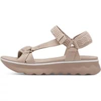 Beige Tamaris women's sandals with wavy sole, adjustable ankle strap, and textured fabric details.