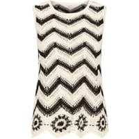 Sleeveless sweater by b.Young with black and white zigzag pattern and floral hem design.