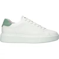 White women's sneakers with green heel tab, lace-up front, and thick sole by Blackstone Stanley Miles.
