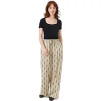 Black scoop neck women's T-shirt by Artlove, short sleeves, paired with beige wide-leg pants with black pattern.