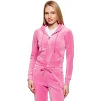 Pink velour zip-up hoodie with drawstring hood and front pockets, worn by a model, by Juicy Couture.