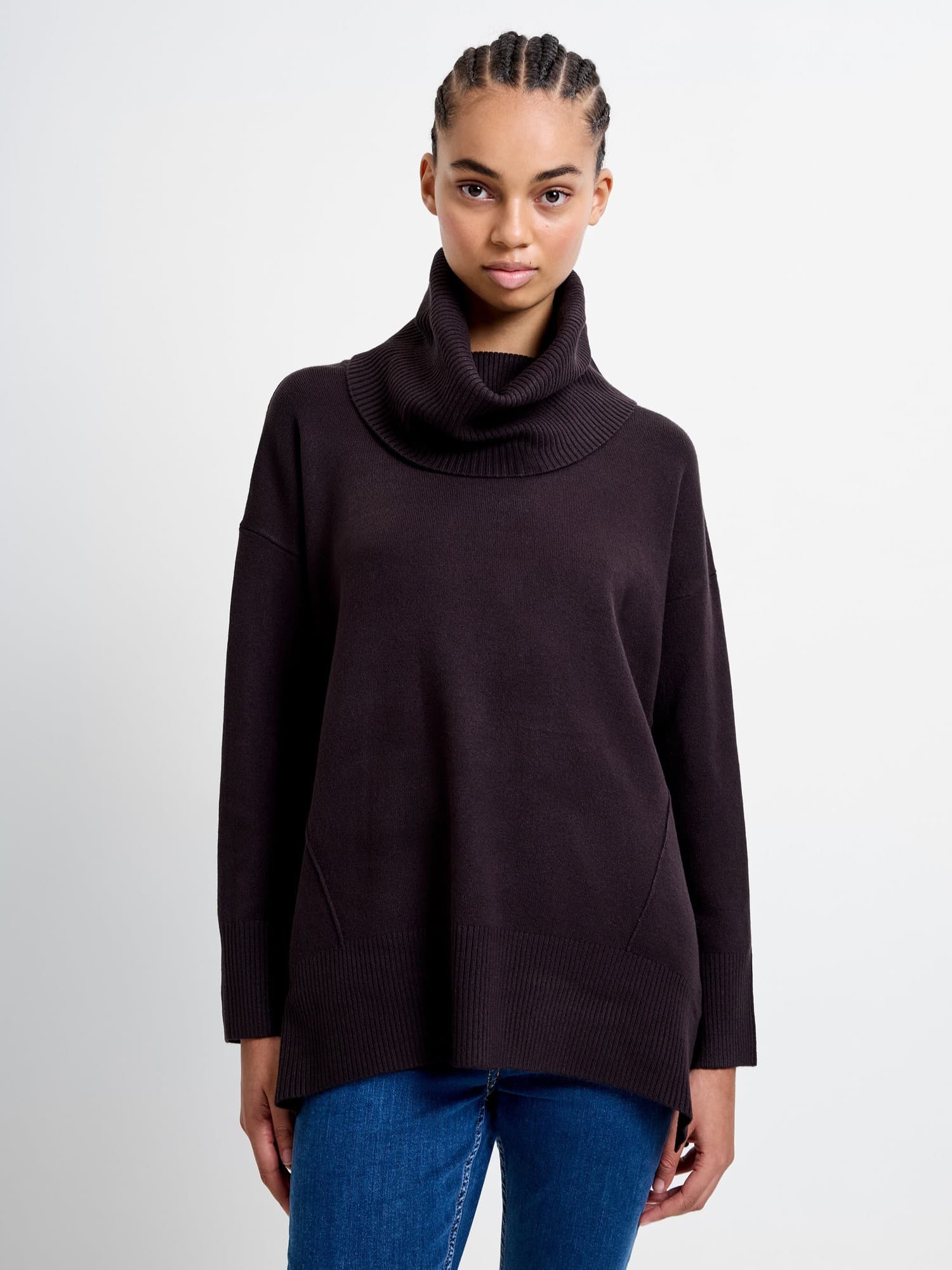 Dark brown ribbed cowl neck jumper with a relaxed fit, featuring long sleeves and side pockets, made from a soft, cozy material.