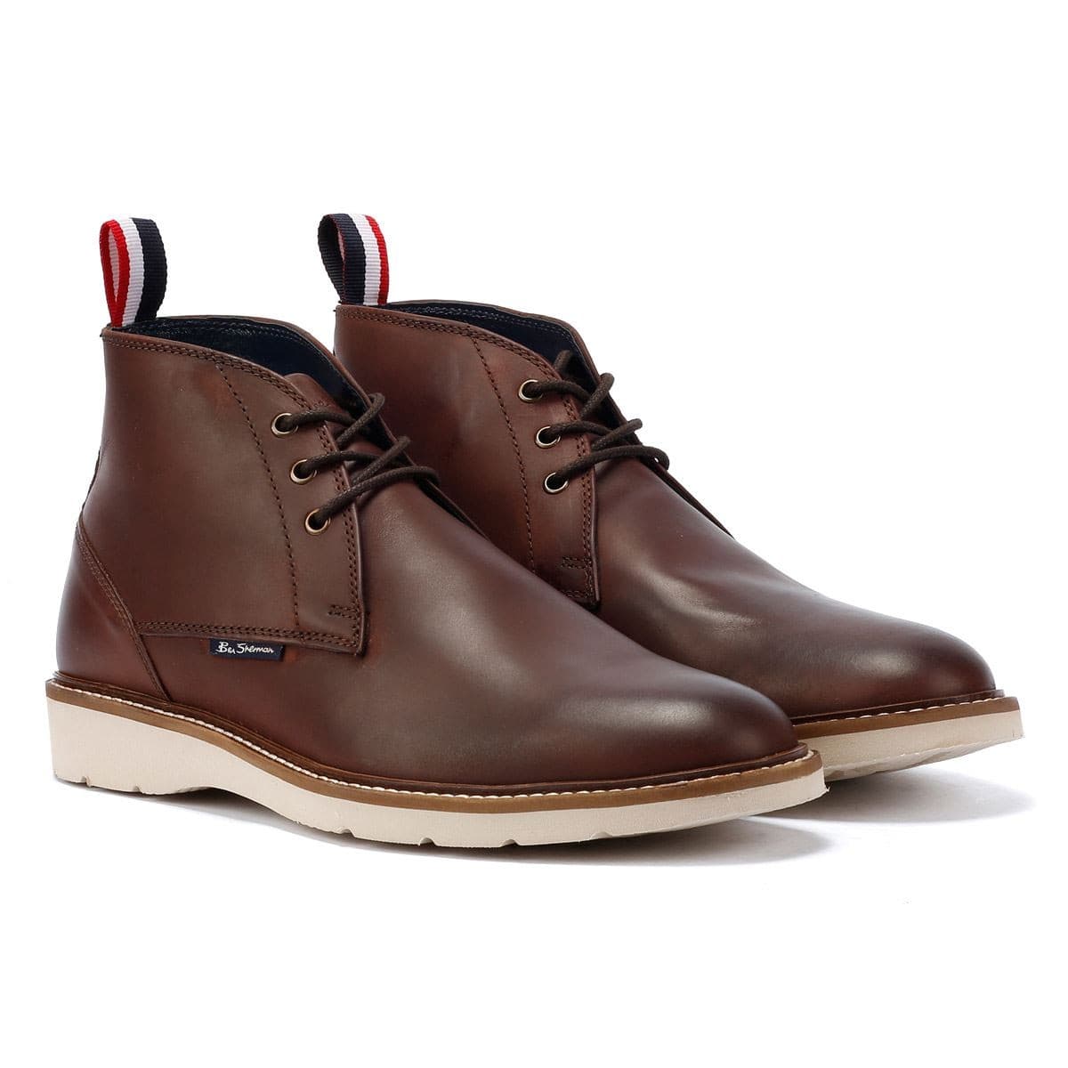 Burgundy leather men's boots by Ben Sherman featuring a smooth finish, lace-up design, contrasting white sole, and signature logo on the side.