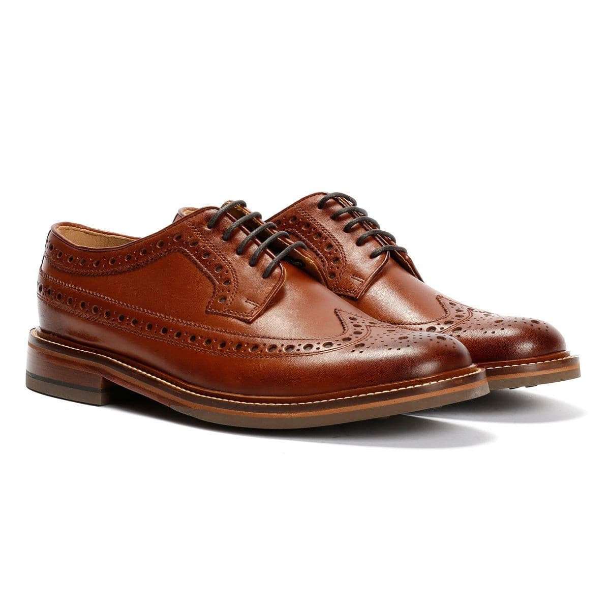 Brown leather longwing brogue shoes featuring intricate perforated detailing, a rounded toe, and a sturdy sole, perfect for country wear.