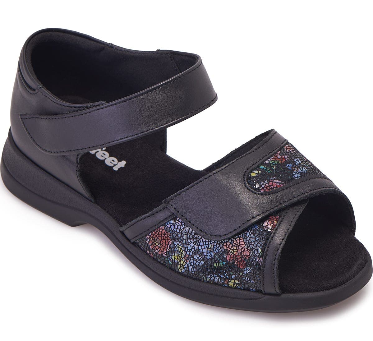 Black leather sandals with extra wide fit, featuring a colorful floral patterned strap and adjustable Velcro closures for comfort, designed for swollen feet.