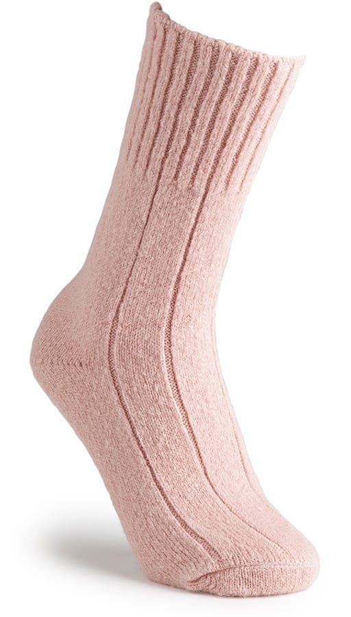 Super-soft, ribbed bed socks in a light pink hue, featuring a cozy, stretchy material designed for comfort and warmth.