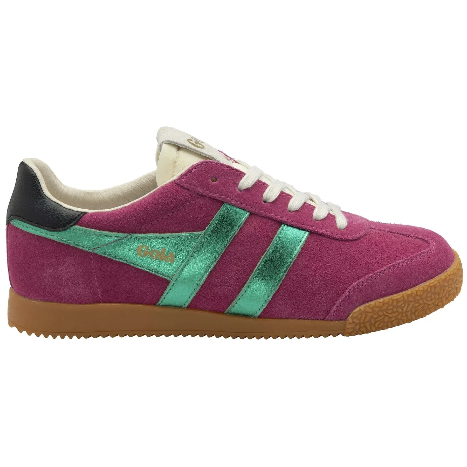 Fuchsia suede trainers with emerald green stripes and black heel, featuring a textured gum sole and white laces, showcasing a retro athletic design.