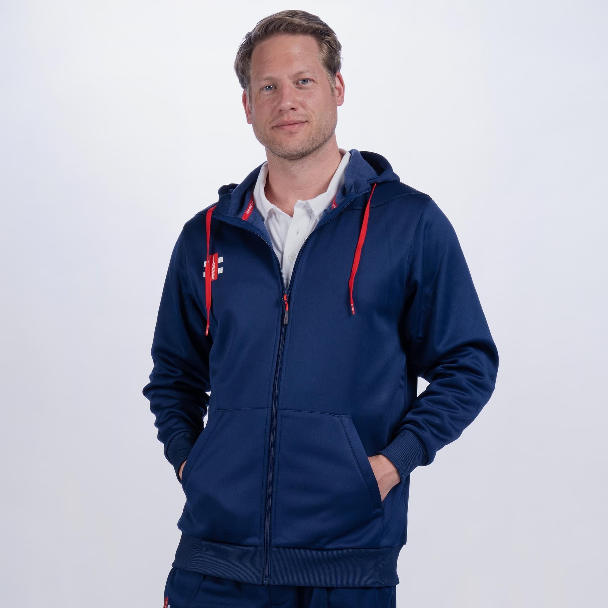 Black Gray-Nicolls Pro Performance Hoodie featuring a zip front, adjustable hood, and contrasting red drawstrings, made from lightweight, moisture-wicking material.