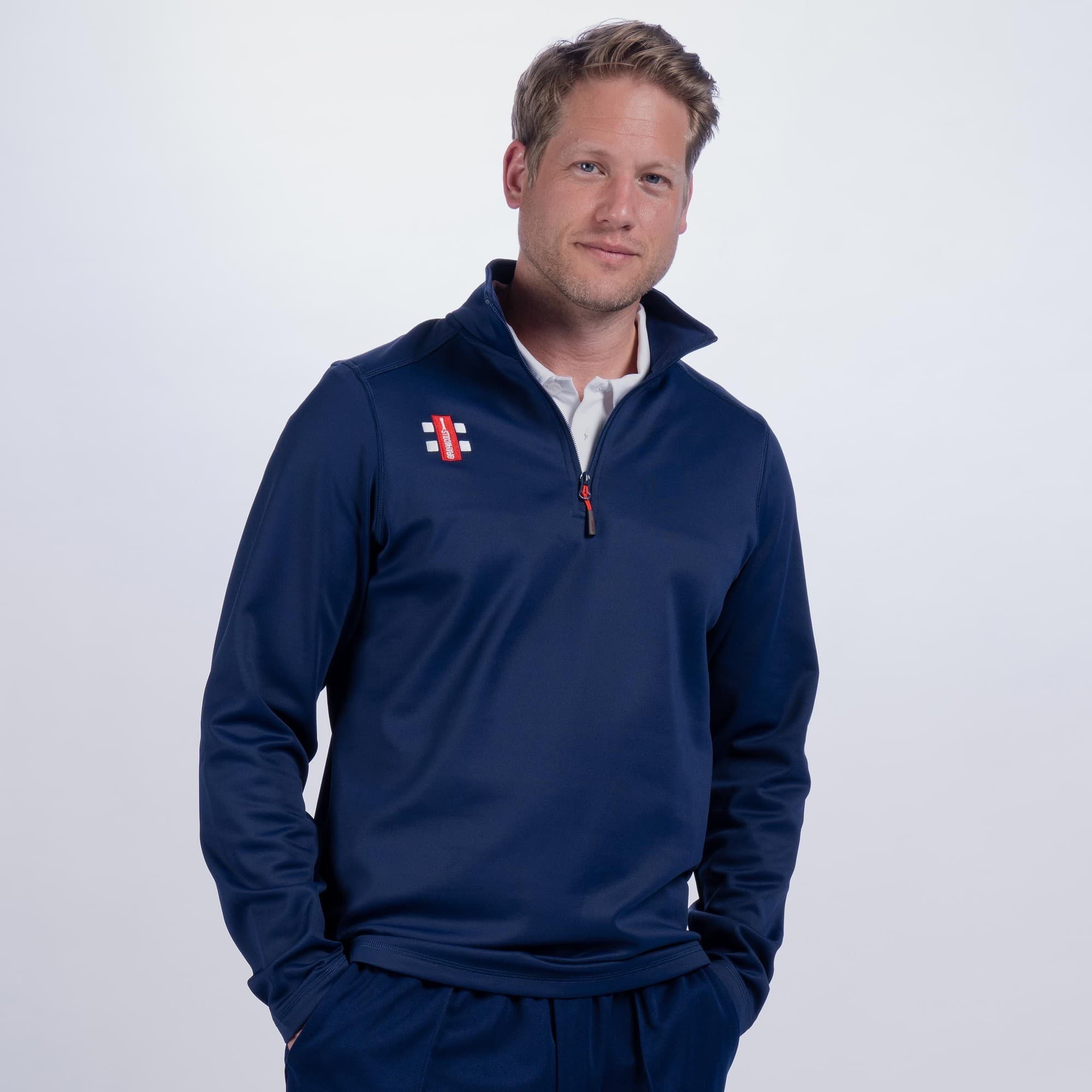 Black Gray-Nicolls Storm Fleece featuring a high collar, quarter zip, and logo on the chest, made from soft, warm material, perfect for outdoor activities.