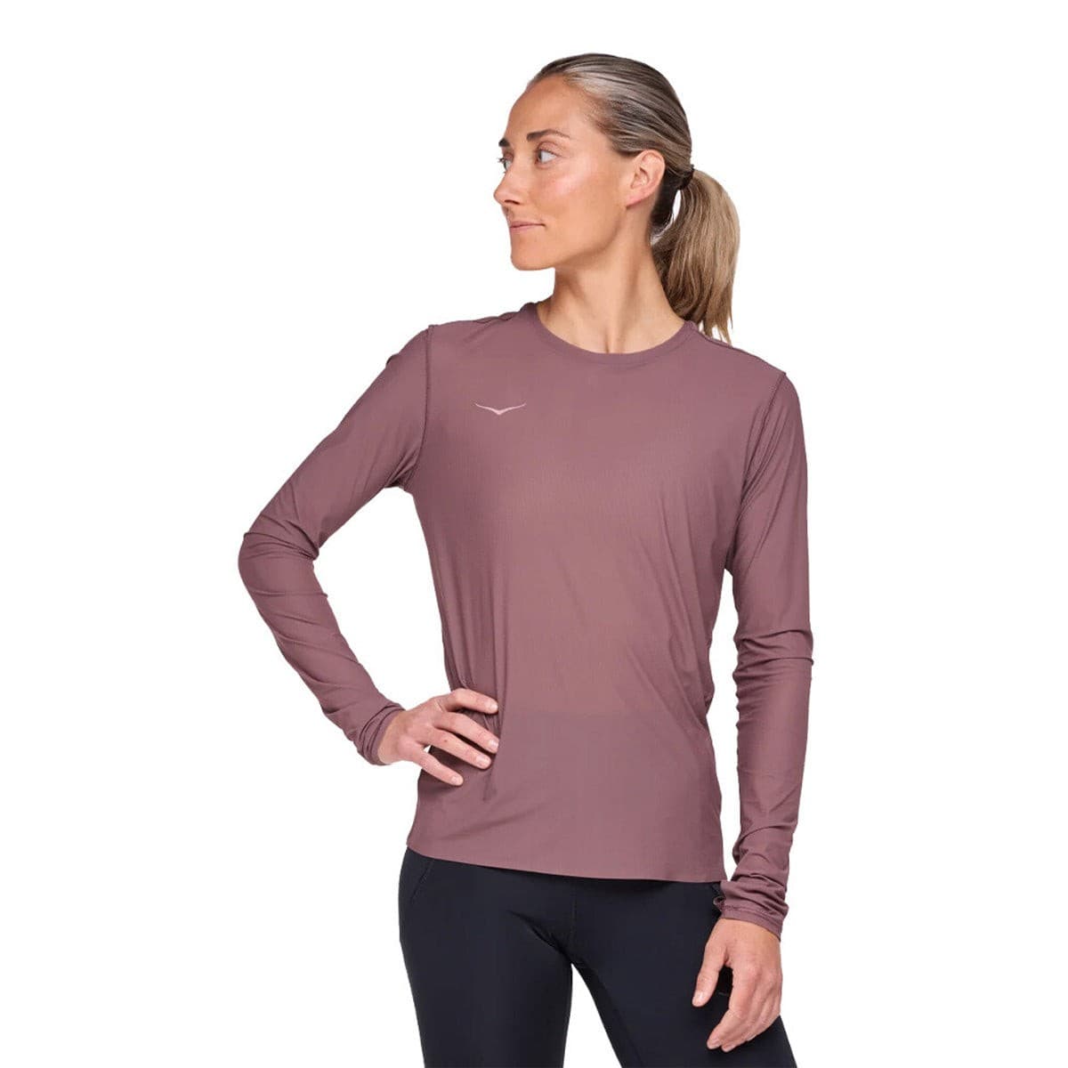 Long-sleeve women's running shirt in Smokey Quartz pink, featuring a lightweight, breathable fabric and a fitted design, ideal for outdoor activities.