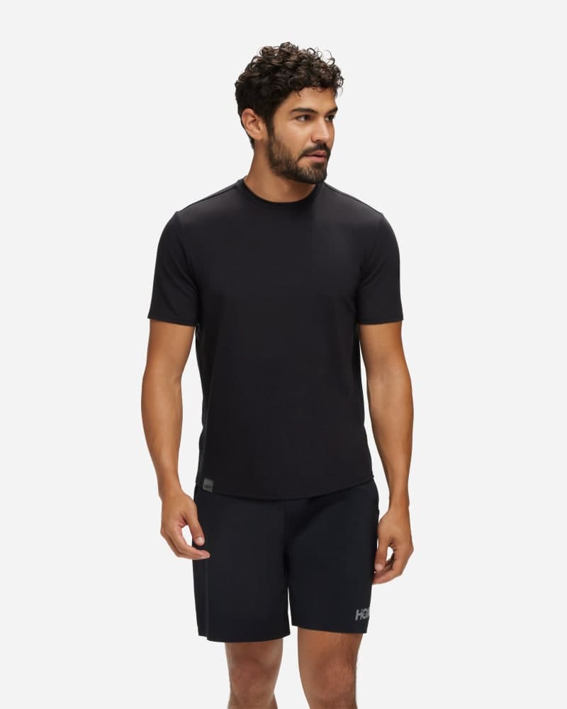 Men's HOKA Essential Shirt in XLarge, featuring a sleek black design, short sleeves, and a lightweight, breathable material ideal for active wear.