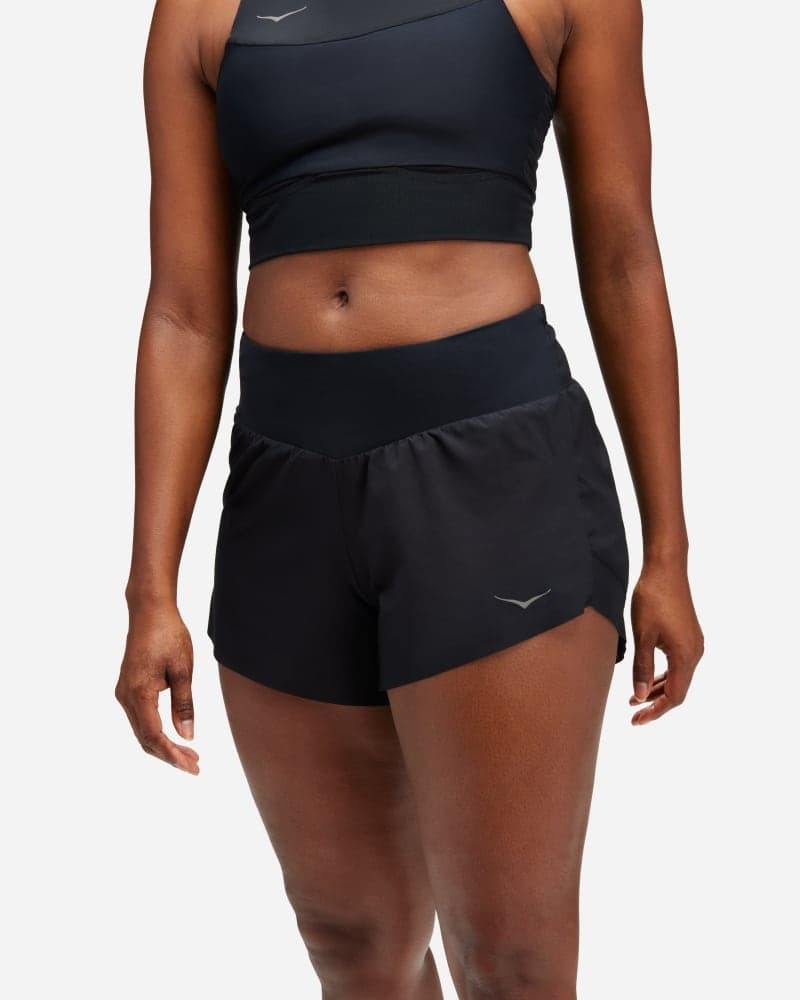 HOKA Women's Glide 4' Shorts in black, size XS, featuring a stretchy waistband, lightweight material, and a sleek design for comfort during workouts.