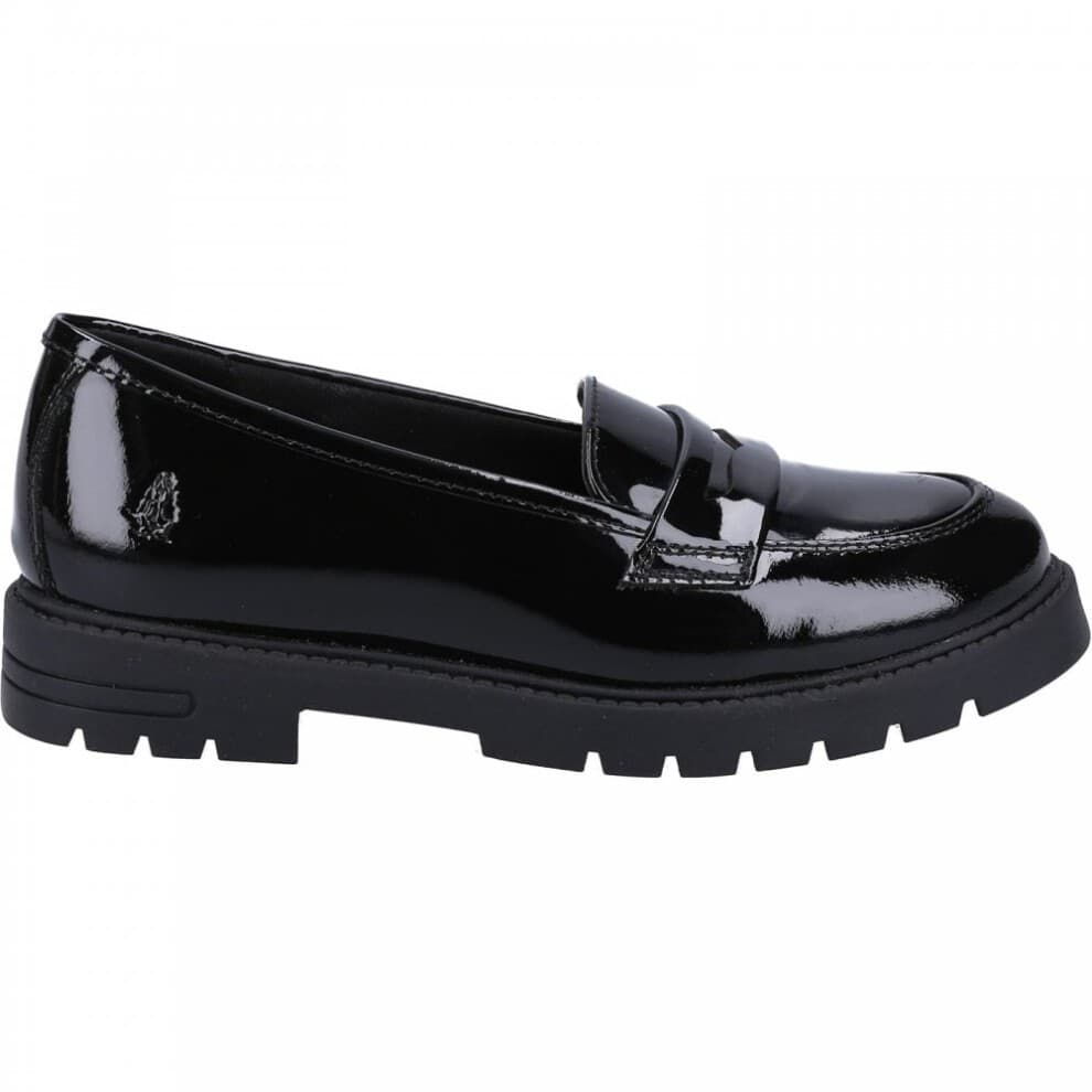 Black patent leather loafers with a sleek design, featuring a classic penny strap and a chunky black sole for added comfort and style.