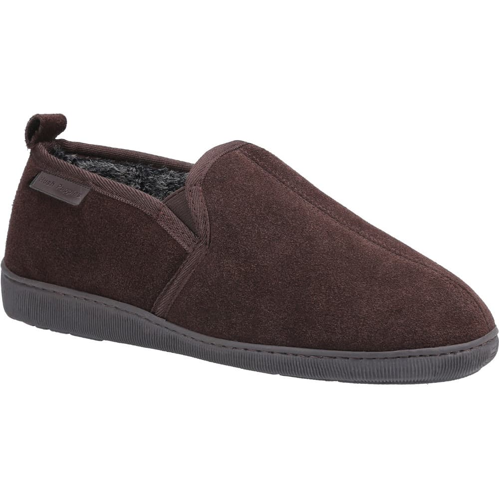Brown suede classic slippers for men by Hush Puppies, featuring a slip-on design, soft interior lining, and a textured rubber sole, available in size 10.