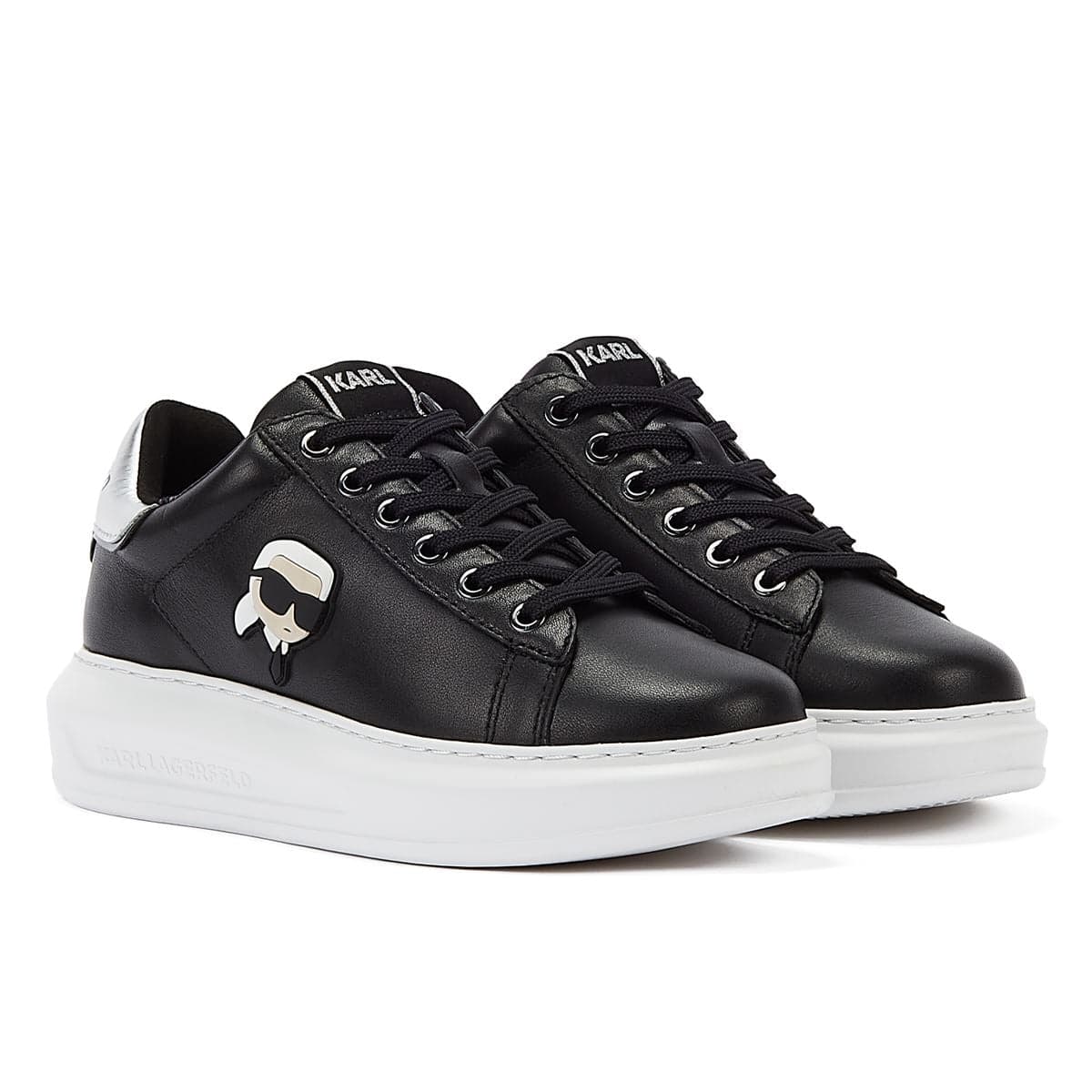 Black leather trainers featuring a glossy white sole, lace-up design, and a signature Karl Lagerfeld logo on the side, available in size UK 3.
