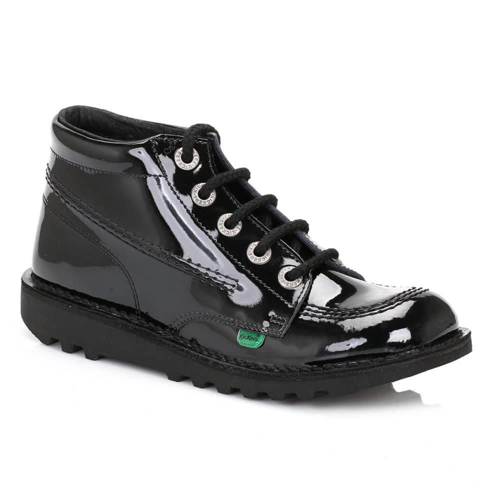 Black patent leather ankle boots with a shiny finish, featuring six eyelets, black laces, and a rugged sole, labeled with a small green Kickers logo. Size 3.