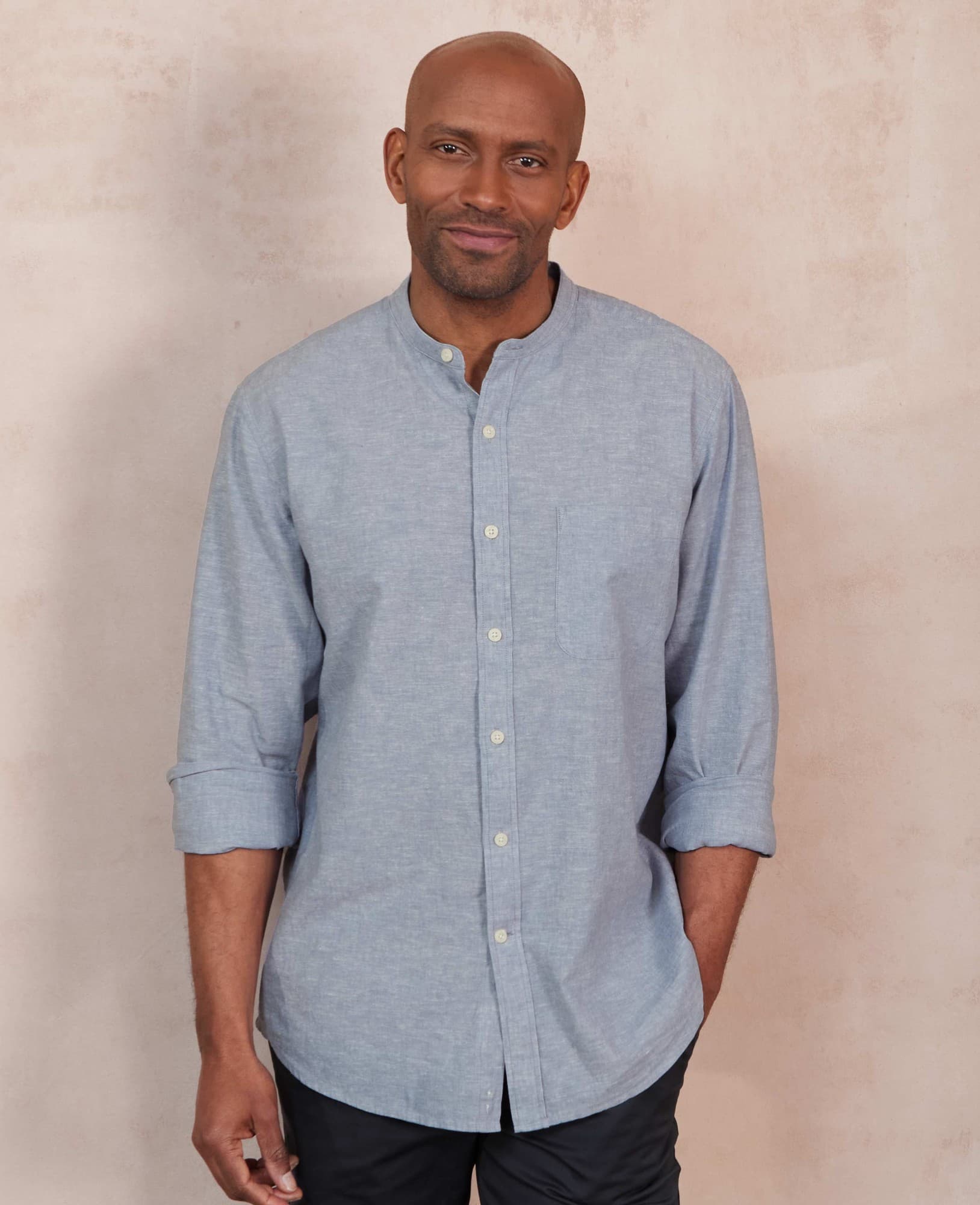 Light blue linen-cotton casual shirt with a grandad collar, featuring a single chest pocket, rolled-up sleeves, and a classic fit, size small.