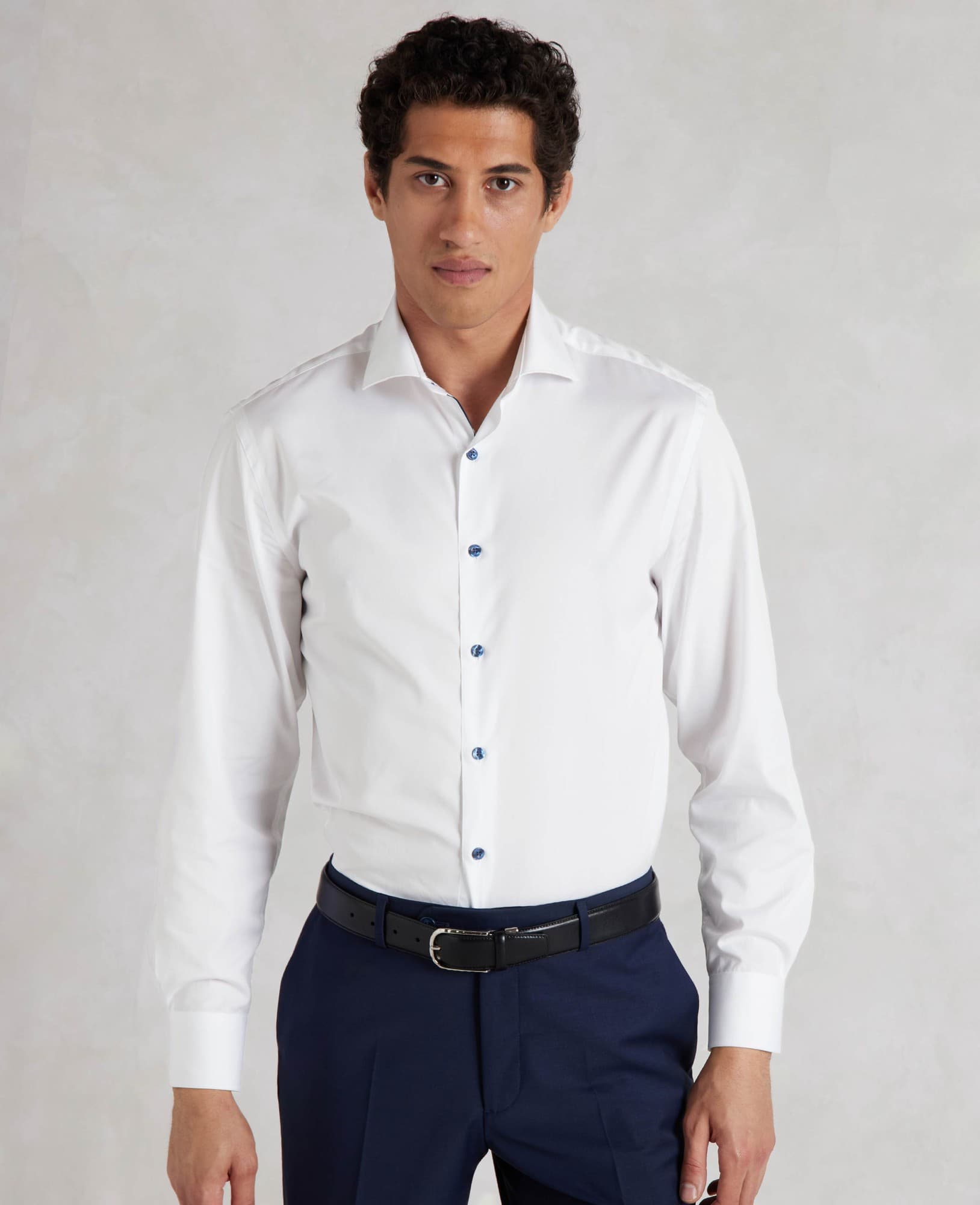 Men's white slim fit smart-casual shirt featuring contrast blue buttons, single cuffs, and a tailored design, available in size XL Extra Long.