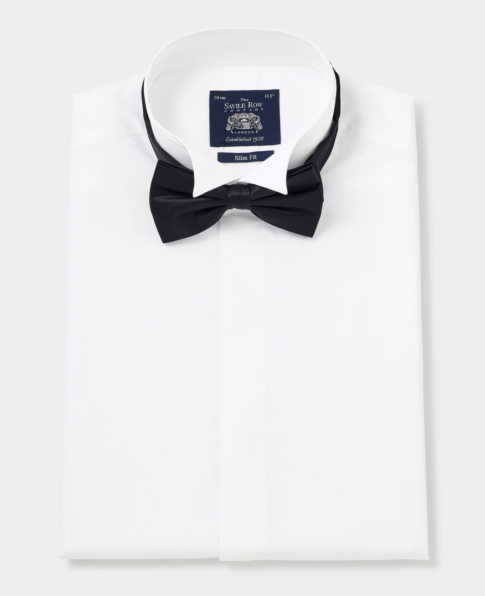 White wing collar slim fit dress shirt with double cuffs, made from crisp fabric, featuring a Savile Row Company label and a black bow tie neatly folded on top.