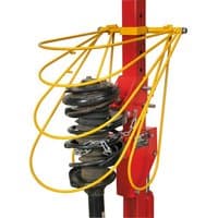 Red and yellow Sealey coil spring compressor restraint system with curved metal bars and mounted spring.
