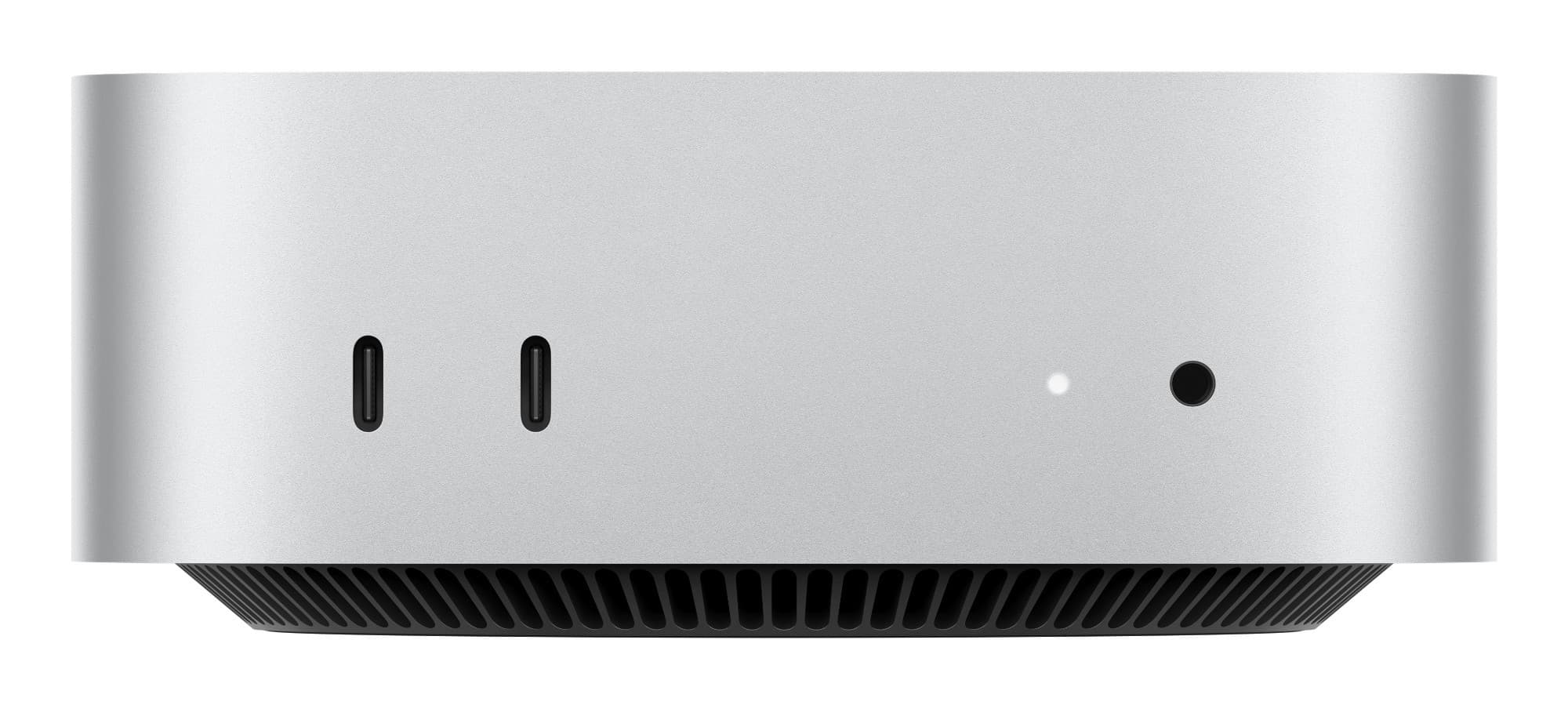 Silver Apple Mac Mini with a sleek design, featuring two USB-C ports, a power indicator light, and a black vented bottom for cooling.