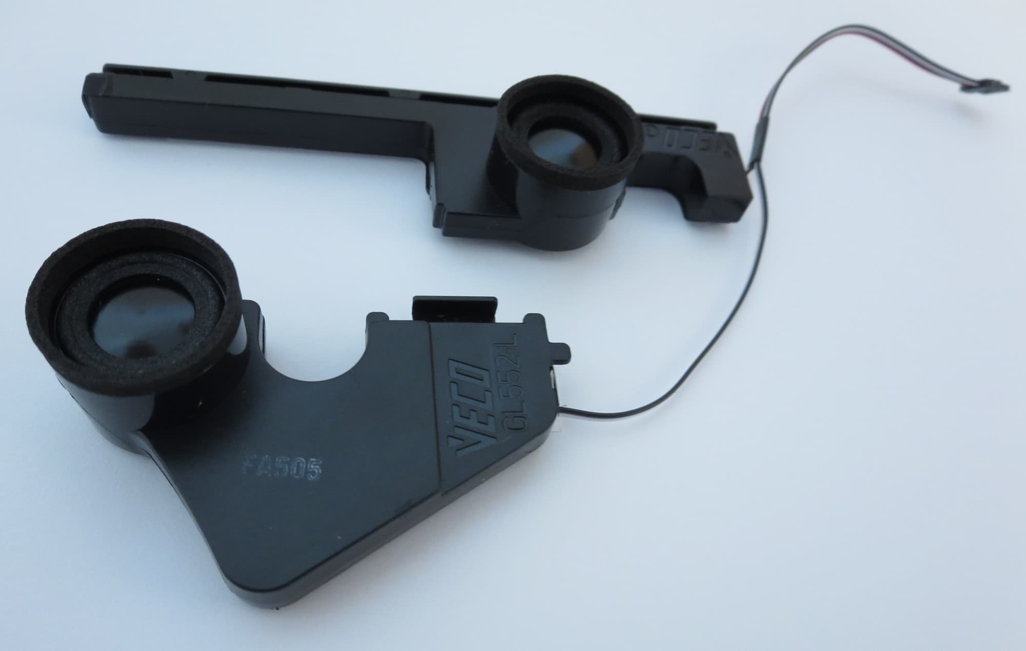 Black plastic laptop speaker assembly with two circular speaker components and a thin wire connector, designed for ASUS laptops.