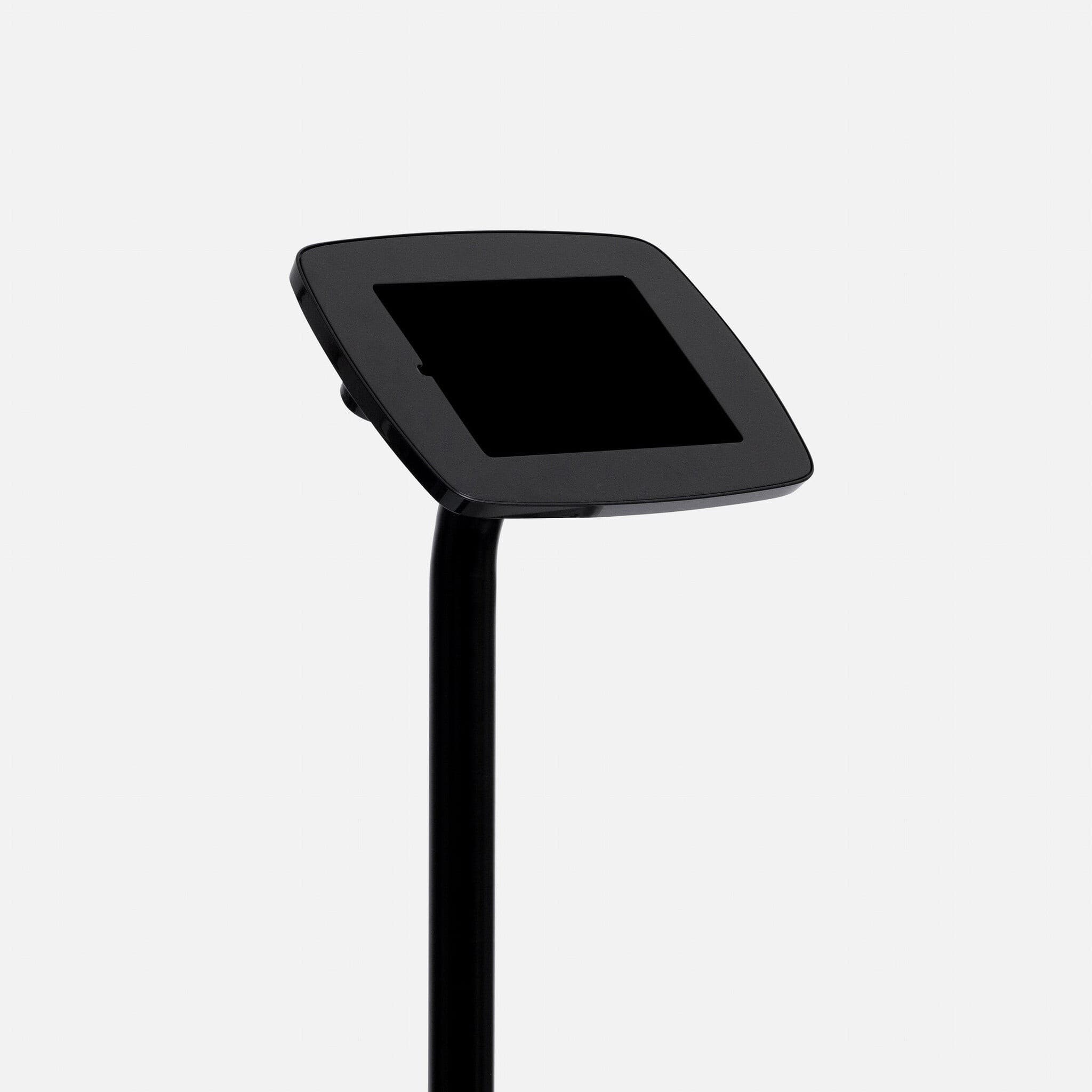 Black Bouncepad Original Elevate with a sleek, angled tablet holder mounted on a tall, sturdy black pole, featuring a USB cable for connectivity.