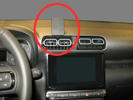 Black passive holder for mobile phones, mounted on a car dashboard above air vents, featuring a sleek design and durable material for secure device placement.