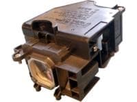 Black projector lamp housing with a clear glass lens, featuring a rectangular shape and multiple connectors, designed for use in projectors, labeled "CoreParts ML12299 200 W."