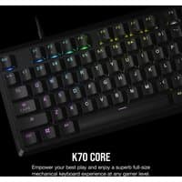 Black Corsair K70 CORE RGB gaming keyboard with colorful backlit keys, USB connection, and UK QWERTY layout.