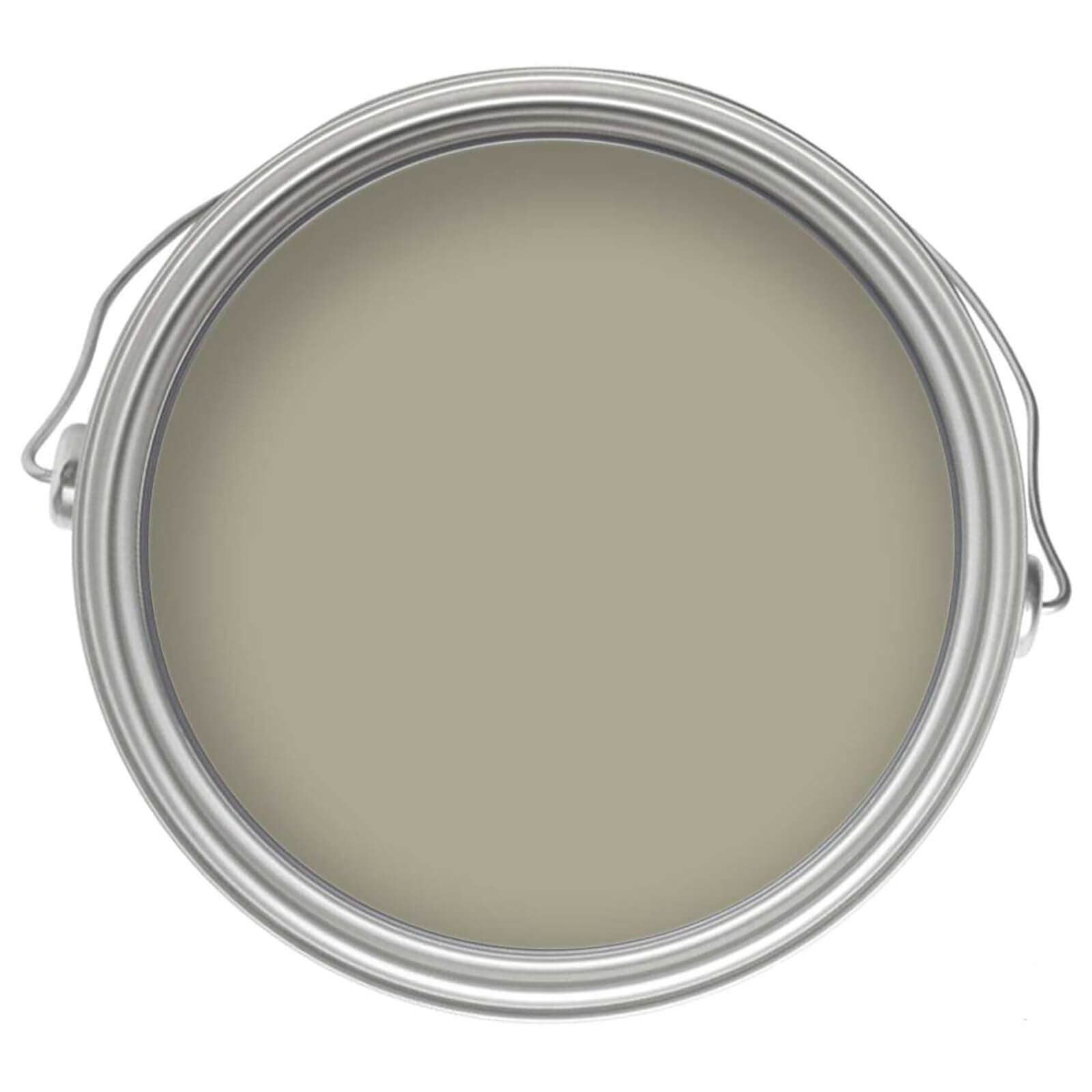Round metal paint can with a silver lid, showcasing a smooth, olive green eggshell paint finish, labeled for interior use on wood and metal surfaces.