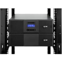 Black Eaton 9E11KIPMR UPS with digital display, dual front panels, and ventilation grilles in a rack setup.