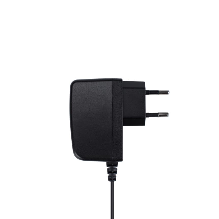 Black compact power adapter with two prongs and a coiled cable, designed for efficient charging of electronic devices.