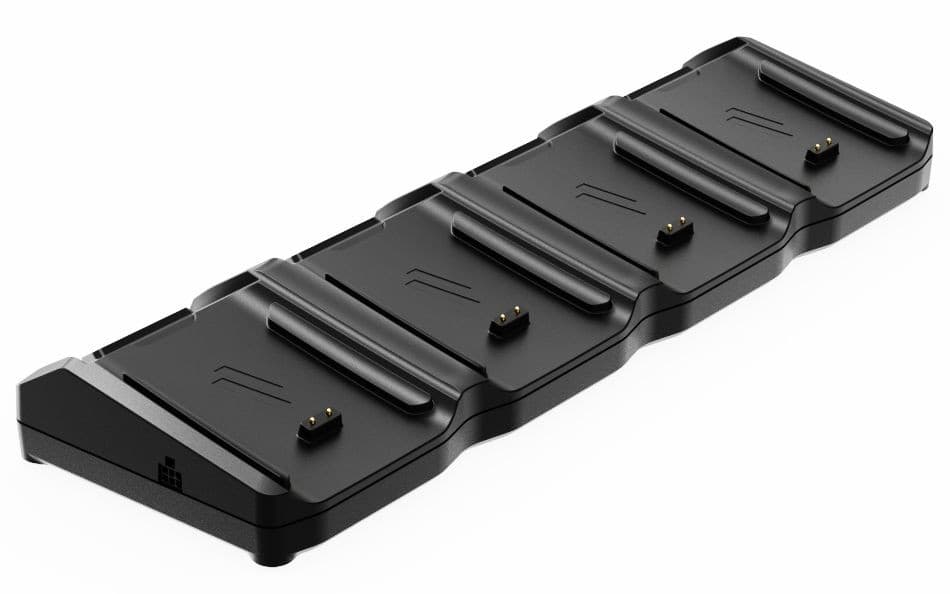 Black plastic charging station with four slots designed for Ingenico devices, featuring gold charging contacts and a sleek, curved design for stability.