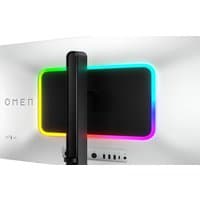 White HP OMEN 31.5" UHD 240Hz OLED monitor with RGB lighting on the back and sleek black stand.