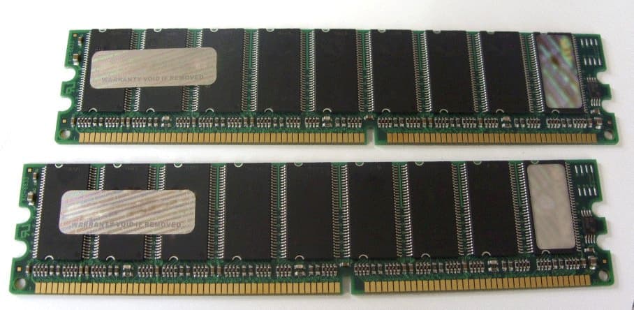 Two Hypertec 512MB ECC DIMM PC3200 memory modules with green circuit boards, black memory chips, and gold connectors, designed for DDR 400 MHz performance.