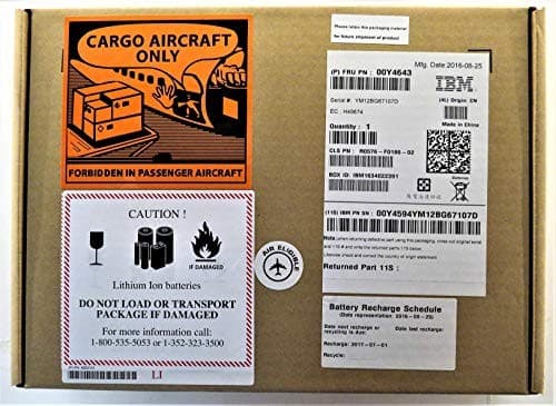 Brown cardboard box with IBM branding, warning labels for cargo aircraft and lithium-ion batteries, and shipping information stickers.