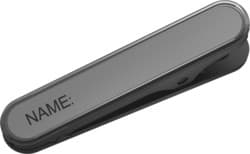Black plastic name tag clip with the word "NAME:" engraved, designed for use with Jabra corded headsets, featuring a sleek and minimalist design.