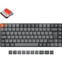 Keychron K3 Max keyboard, slim black design, orange escape key, wireless connectivity, extra keycaps included.