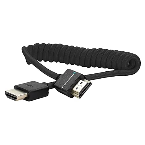 Coiled black HDMI cable, 1.2 meters long, featuring standard HDMI Type A connectors at both ends, with a durable, flexible design for easy handling.