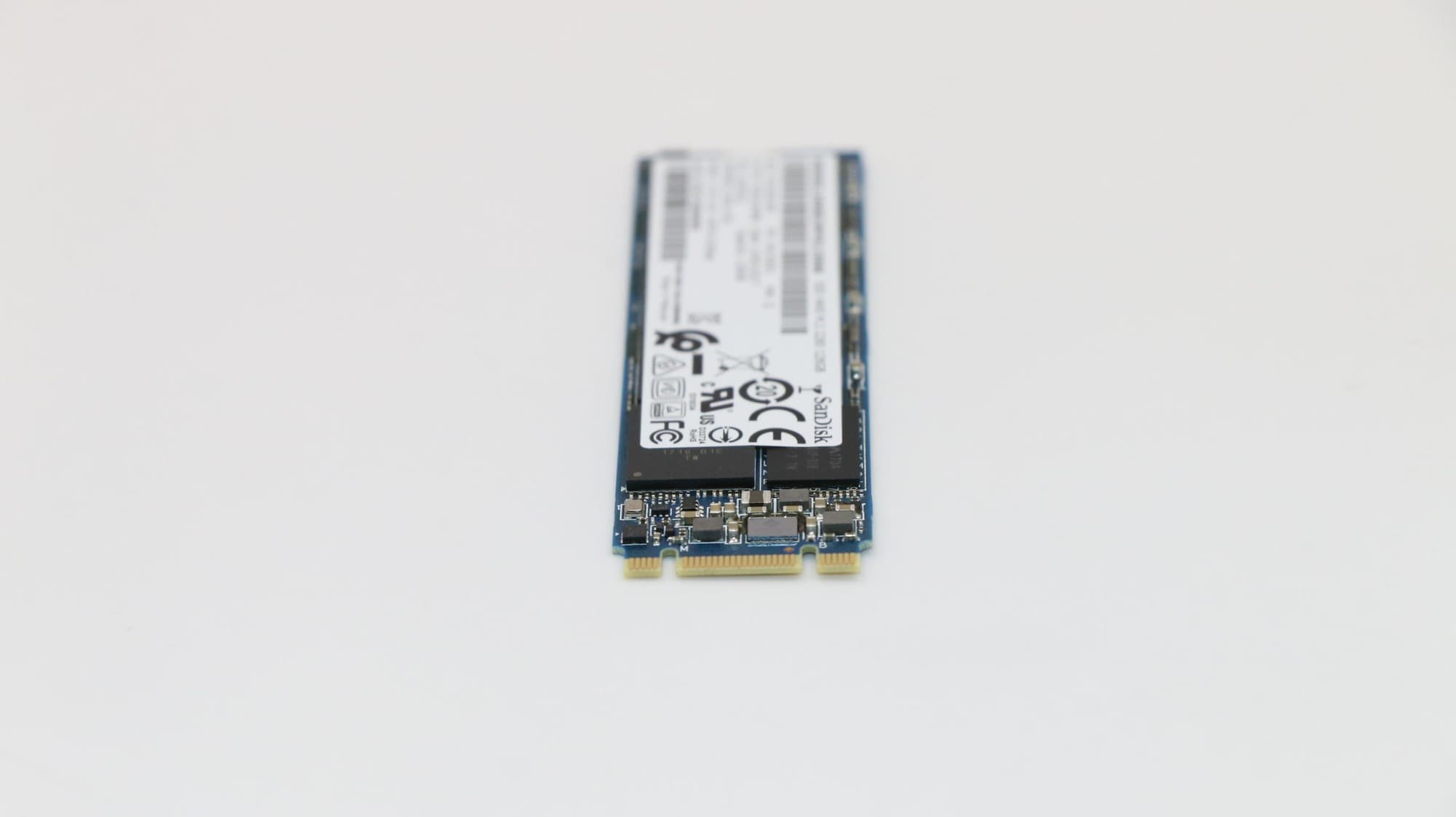 Lenovo 00UP462 Internal Solid State Drive with a blue circuit board, black label, and gold connectors, featuring a compact M.2 design and 1.02 TB storage capacity.