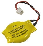 Yellow lithium backup battery with a round shape, featuring a printed label with text, and two attached wires (red and black) ending in a connector.