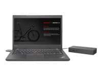 Lenovo Thunderbolt 3 Essential Dock in grey, featuring multiple ports and a sleek design, connected to a black laptop displaying a bicycle graphic on the screen.